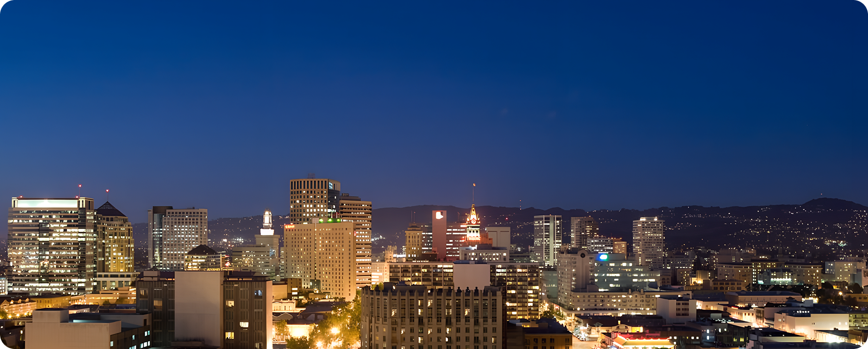 City at night from the top of a hill